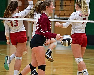 BELOIT, OHIO - OCTOBER 24, 2017: Mooney's Maria Pelini, center, slams the ball in frustration while Crestwood's Mariah Kess, left, and Slate Bretz, right, celebrate winning the first set during their OHSAA Tournament match, Wednesday night at West Branch High School. DAVID DERMER | THE VINDICATOR