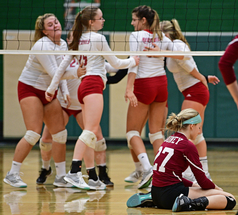 BELOIT, OHIO - OCTOBER 24, 2017: Mooney's Kaylin Bowman sits on the floor while the Crestwood players celebrate across from her after defeating Mooney three sets to none during their OHSAA Tournament match, Wednesday night at West Branch High School. DAVID DERMER | THE VINDICATOR