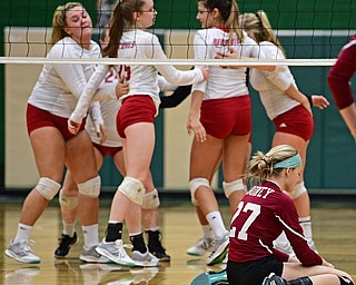BELOIT, OHIO - OCTOBER 24, 2017: Mooney's Kaylin Bowman sits on the floor while the Crestwood players celebrate across from her after defeating Mooney three sets to none during their OHSAA Tournament match, Wednesday night at West Branch High School. DAVID DERMER | THE VINDICATOR