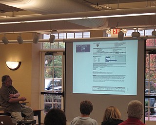Neighbors | Zack Shively.Dr. Bill Snyder, retired chemistry professor, went over a sample version of a soil test during his presentation at the Poland library on Oct. 11. The extension gave everyone an opportunity for a free soil test.
