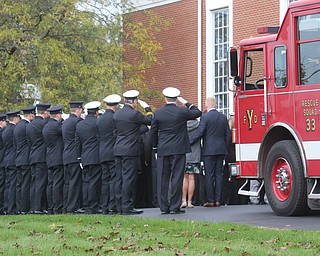     ROBERT K. YOSAY  | THE VINDICATOR..The casket carrying the body of Battalion Chief  as family members  and honor guard nearby..Funeral Services for YFD  Battalion Chief Ron Russo were held Thursday at  Poland United Methodist Church ..The funeral procession then went from PUM to Fire Station  #1 and then to Green Haven  .Russo, 64, was a member of the city fire department for 37 years, working the rescue squad for the majority of his career...-30-