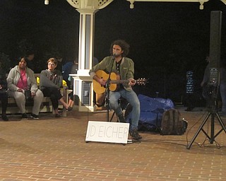 Neighbors | Zack Shively.Singer J.D. Eicher performed throughout the Pumpkin Walk at Twilight at Fellows Riverside Gardens. His music could be heard at most areas of the walk.