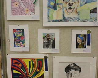 Neighbors | Abby Slanker.Several pieces of Canfield High School art students’ work were on display at the Canfield library through a partnership with the school and the library on Oct. 19.