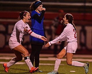NILES, OHIO - OCTOBER 26, 2017: Canfield's Marissa Ieraci, right, gets a hug from Alana Petracci after kicking the game winning goal during the second half of their OHSAA tournament game, Thursday night at Niles High School. DAVID DERMER | THE VINDICATOR..Lakeview's Isabel Wilson pictured.