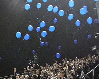 Blue balloons were launched at the kickoff of Girard Liberty football game.