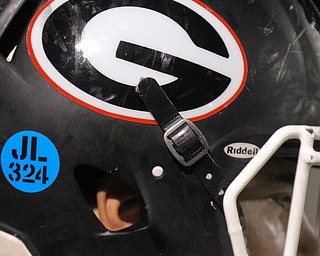 Girard football players placed a decal with the badge number of slain gird PD officer Justin Leo on their helmets.