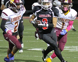 William D. Lewis The Vindicator Girard' sDevin Wilson(3) is pursued by Liberty's Capone Haywood(2) and Dra Ruston(1) during 1rst half action 10272017 in Girard.