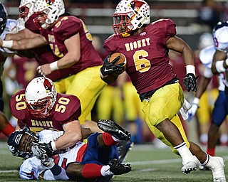 YOUNGSTOWN, OHIO - OCTOBER 27, 2017: Mooney's Andre McCoy runs the ball behind a block from Tyler Petrey on Fitch's Jakari Lumsden during the first half of their game Friday night at Stambaugh Stadium. DAVID DERMER | THE VINDICATOR