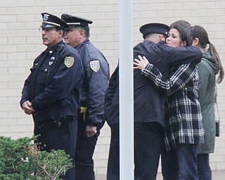 William D. Lewis The Vindicator  Unidentified mourners embrace while waiting to enter the Covelli Centre for slain police officer Justin Leo's calling hours 10-28-17.