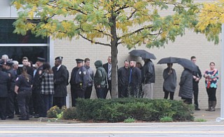 William D. Lewis The Vindicator  Police officers and mourners  file into the Covelli Centre for slain police officer Justin Leo's calling hours 10-28-17.