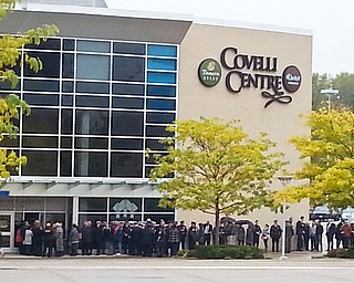 William D. Lewis The Vindicator Mourners file into the Covelli Centre for slain police officer Justin Leo's calling hours 10-28-17.