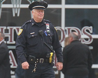 William D. Lewis The Vindicator  A police officer pauses after leavingthe Covelli Centre for slain police officer Justin Leo's calling hours 10-28-17.