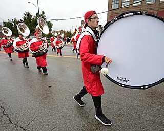 YOUNGSTOWN, OHIO - OCTOBER 28, 2017: YSU band member Kyle Rockwell of McDonald, Pennsylvania bangs on his bass drum on Fifth Avenue during the YSU homecoming parade, Saturday afternoon. DAVID DERMER | THE VINDICATOR