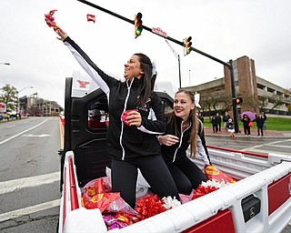 YOUNGSTOWN, OHIO - OCTOBER 28, 2017: Youngstown State cheerleaders Juliana Cario from Girard, left, and Casey Roberts Austintown smile as Cario throws some candy to spectators of the YSU homecoming parade on Fifth Avenue during the YSU homecoming parade, Saturday afternoon. DAVID DERMER | THE VINDICATOR
