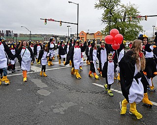 YOUNGSTOWN, OHIO - OCTOBER 28, 2017: People dressed up as penguins march on Fifth Avenue during the YSU homecoming parade, Saturday afternoon. DAVID DERMER | THE VINDICATOR