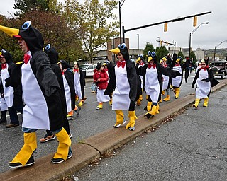 YOUNGSTOWN, OHIO - OCTOBER 28, 2017: People dressed up as penguins march on Fifth Avenue during the YSU homecoming parade, Saturday afternoon. DAVID DERMER | THE VINDICATOR