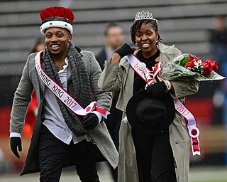 YOUNGSTOWN, OHIO - OCTOBER 28, 2017: Youngstown State students Willie Parker and Tierney McCaster smile after being crowned homecoming king and queen during a halftime ceremony during a game between the Youngstown State Penguins and Illinois State Redbirds, Saturday afternoon at Stambaugh Stadium. Illinois State won 35-0. DAVID DERMER | THE VINDICATOR