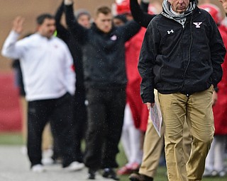 YOUNGSTOWN, OHIO - OCTOBER 28, 2017: Youngstown State head coach Bo Pelini walks on the sideline during the second half of their game, Saturday afternoon at Stambaugh Stadium. Illinois State won 35-0. DAVID DERMER | THE VINDICATOR