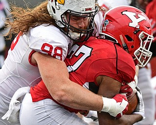 YOUNGSTOWN, OHIO - OCTOBER 28, 2017: Illinois State's Dalton Keene tackles Youngstown State's Tevin McCaster in the backfield during the second half of their game, Saturday afternoon at Stambaugh Stadium. Illinois State won 35-0. DAVID DERMER | THE VINDICATOR