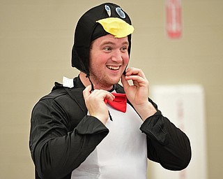 YOUNGSTOWN, OHIO - OCTOBER 28, 2017: Jarin Mcintosh from Wellsville puts on his penguin hat inside the WATTS Training Facility, Saturday morning. DAVID DERMER | THE VINDICATOR