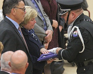 William D Lewis The vindicator An honor guard member presents folded flag from casket of slain Giard police officer Justin Leo to his parents David and Pat Leo.