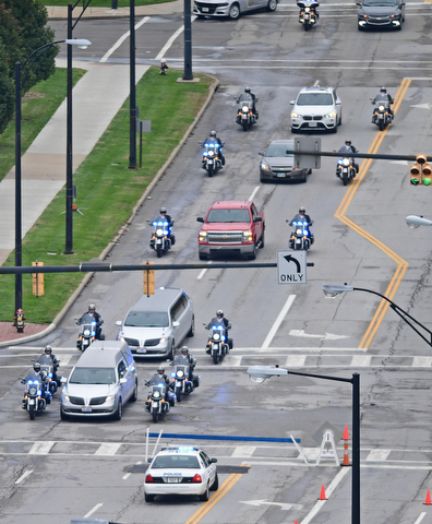 YOUNGSTOWN, OHIO - OCTOBER 29, 2017: The funeral procession for Officer Justin Leo makes it way to Beeghley Center up Fifth Avenue in Youngstown, Sunday afternoon. DAVID DERMER | THE VINDICATOR