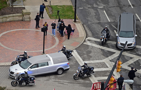 YOUNGSTOWN, OHIO - OCTOBER 29, 2017: The hearse with Office Justin Leo is escorted onto Armed Forces Boulevard from Fifth Avenue in Youngstown, Sunday afternoon. DAVID DERMER | THE VINDICATOR