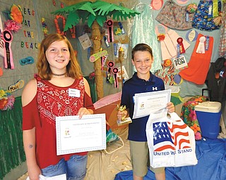 Pictured above, from left are Desi Wray and Cerek Szczyglowski, who participated in the fifth-grade division of the Trumbull Retired Teachers Spelling Bee that took place at the Trumbull County Fair. Students received gift bags containing coupons and school supplies. Szczglowski won the trophy for the division.
