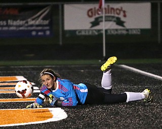 Springfield Local goalie Lex Slike (11) watches the ball before it is kicked into the net by Elyria Catholic forward Delaney Stringer (37) during the first half as Elyria Catholic High School takes on Springfield Local High School in the Division III Region 9 Regional Semi-Finals, Tuesday, Oct. 31, 2017, at Green Memorial Stadium in Uniontown. Elyria won 6-0...(Nikos Frazier | The Vindicator)..