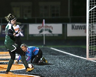Springfield Local goalie Lex Slike (11) watches the ball before it is kicked into the net by Elyria Catholic forward Delaney Stringer (37) during the first half as Elyria Catholic High School takes on Springfield Local High School in the Division III Region 9 Regional Semi-Finals, Tuesday, Oct. 31, 2017, at Green Memorial Stadium in Uniontown. Elyria won 6-0...(Nikos Frazier | The Vindicator)..