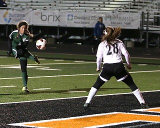 Elyria Catholic forward Emilie Uhnak (4) tries to kick in a goal against Springfield Local defender Shantel Springer (28) during the first half as Elyria Catholic High School takes on Springfield Local High School in the Division III Region 9 Regional Semi-Finals, Tuesday, Oct. 31, 2017, at Green Memorial Stadium in Uniontown. Elyria won 6-0...(Nikos Frazier | The Vindicator)..