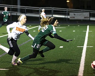 Springfield Local midfielder Cierra Latronica (24) and Elyria Catholic defender Riley Doll (22) collide during the second half as Elyria Catholic High School takes on Springfield Local High School in the Division III Region 9 Regional Semi-Finals, Tuesday, Oct. 31, 2017, at Green Memorial Stadium in Uniontown. Elyria won 6-0...(Nikos Frazier | The Vindicator)..