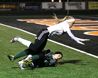 Springfield Local midfielder Cierra Latronica (24) and Elyria Catholic defender Riley Doll (22) collide during the second half as Elyria Catholic High School takes on Springfield Local High School in the Division III Region 9 Regional Semi-Finals, Tuesday, Oct. 31, 2017, at Green Memorial Stadium in Uniontown. Elyria won 6-0...(Nikos Frazier | The Vindicator)..