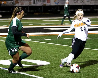 Springfield Local midfielder Cierra Latronica (24) tries to keep the ball away from Elyria Catholic midfielder Meredith Flanagan (32) during the second half as Elyria Catholic High School takes on Springfield Local High School in the Division III Region 9 Regional Semi-Finals, Tuesday, Oct. 31, 2017, at Green Memorial Stadium in Uniontown. Elyria won 6-0...(Nikos Frazier | The Vindicator)..
