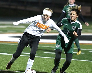 Springfield Local midfielder Anna Rothwell (29) tries to keep Elyria Catholic midfielder Avery Doll (7) away from the ball during the second half as Elyria Catholic High School takes on Springfield Local High School in the Division III Region 9 Regional Semi-Finals, Tuesday, Oct. 31, 2017, at Green Memorial Stadium in Uniontown. Elyria won 6-0...(Nikos Frazier | The Vindicator)..