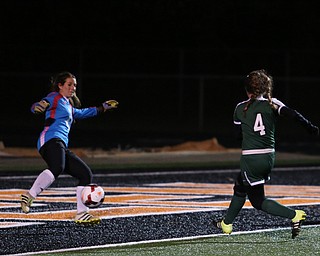 Elyria Catholic forward Emilie Uhnak (4) scores a goal against Springfield Local goalie Lex Slike (11) during the second half as Elyria Catholic High School takes on Springfield Local High School in the Division III Region 9 Regional Semi-Finals, Tuesday, Oct. 31, 2017, at Green Memorial Stadium in Uniontown. Elyria won 6-0...(Nikos Frazier | The Vindicator)..