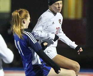 William D. Lewis the Vindicator Canfield's Camryn Kohout(20) and Revere's Amanda Nelson(11) during 10312017 action at Ravenna.