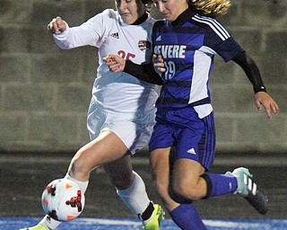 William D. Lewis the Vindicator Canfield's Hanna Stein(25) and Revere's Nicole Langenfield(19) during 10312017 action at Ravenna.