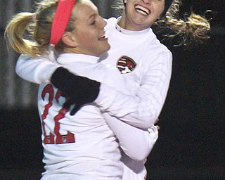 William D. Lewis the Vindicator Canfield's Chloe Kalina(22) gets congrats from Morgan Carey(9) after scoring during 10312017 action at Ravenna.