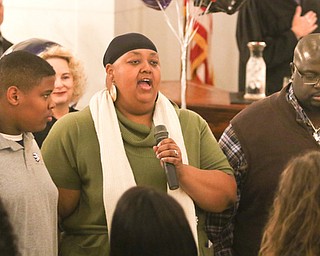 ROBERT K. YOSAY | THE VINDICATOR..A young girl found a new home as Judge Robert N. Rusu of Mahoning County Probate Court presided over her adoption in the courthouse rotunda during the countyÕs fourth Adoption Day celebrationÓ ..\Anthon Jacind and Randy Madison prefer m the national anthem..-30-