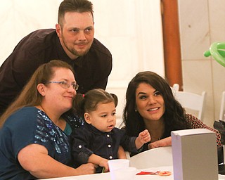 ROBERT K. YOSAY | THE VINDICATOR..A young girl found a new home as Judge Robert N. Rusu of Mahoning County Probate Court presided over her adoption in the courthouse rotunda during the countyÕs fourth Adoption Day celebrationÓ ..the new 'family" Teresa (ok) Shawn Jacqueline and Kera Yelkin (court appointed Special Advocate) thru children services.-30-