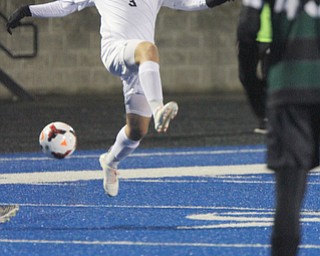   WILLIAM D LEWIS  | THE VINDICATOR..Howlands #3 Fraci Cesta sends the ball up field as Auraro #43  Avery McMaster  looks on..Division II regional semifinal boys soccer Howland vw Aurora at Ravenna Stadium..-30-