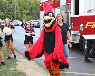 Neighbors | Abby Slanker.Canfield’s school mascot, Big Red, arrived at the Canfield Community Tailgate on a Cardinal Joint Fire District fire truck with lights flashing and sirens blaring on Sept. 15.