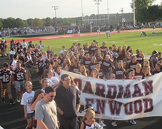 Neighbors | Zack Shively.After the pep rally, Boardman students, athletes and alumni paraded around the track before pregame. The different Boardman schools marched together.