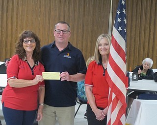 Neighbors | Zack Shively.The Austintown Eagles Ladies Auxiliary raised more than $3,925 for the Potential Development School for Students with Autism through a Quarter Raffle. The Chaplain of the Ladies Auxiliary, Ruth Kritter, organized the event with co-chair Sue DeVito, a trustee of the Ladies Auxiliary. Pictured are, from left, Kritter, Paul Garchar of Potential Development and DeVito.