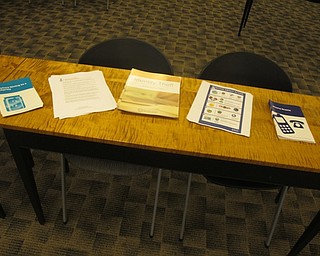 Neighbors | Zack Shively.Melissa Ames with the Better Business Bureau gave handouts with security tips on them for the attendees of the event at the library. The remaining extras went to the Austintown library.