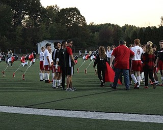 Neighbors | Abby Slanker.Members of the Canfield High School boys soccer team greeted senior soccer player Sam Accordino as he was escorted onto the field by his family during Senior Night on Oct. 3.