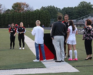 Canfield High School girls varsity soccer Head Coach Phil Simone greeted senior team member Macey Malinky and her family during Senior Night on Oct. 9.