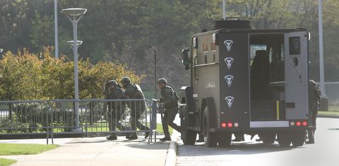  ROBERT K YOSAY  | THE VINDICATOR..The Mahoning Valley Crisis Response Team/SWAT consisting of police officers from the three counties along with YFD and STATMedEvac  had a mock scenario at the Covelli center. The SWAT exercise was to test new radios and equipment as well as prepare for an actual event.SWAT officers  exit 'beast' to breach the building.-30-