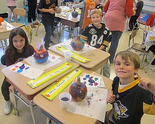 Neighbors | Zack Shively.Katina Soltis chairs the PTO's classroom art projects. She said all parties involved in the event enjoyed it because the students liked working with the parents, it gave the PTO a chance to give back to the schools and it gave the teacher a break. They hold multiple art projects throughout the year. The project this month was a pumpkin decoration because Halloween was near. Pictured are the projects of, clockwise from left, Arianna Reyes, Antonio Dedo and Patrick Rothraulf.